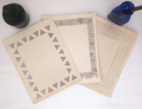 Three sheets of aged paper featuring different decorative borders.